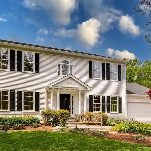 ELEGANT COLONIAL RETREAT ON TRANQUIL ONE-ACRE LOT
