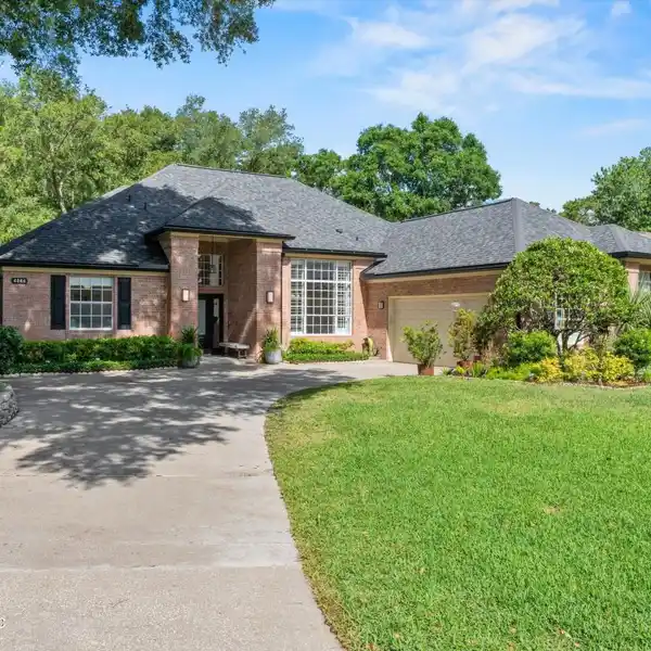 ELEGANT BRICK HOME WITH TRANQUIL WATER VIEWS