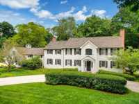ELEGANT RIVERSIDE HOME ON NEARLY TWO ACRES