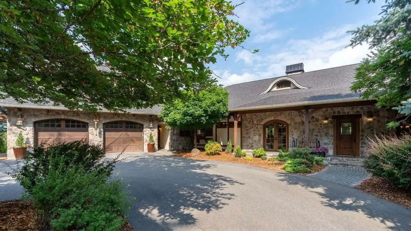 Two Homes, One Spectacular Estate: 9.39 Acres Overlooking Hayden Lake