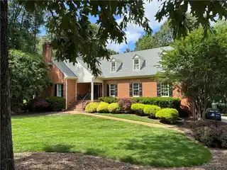 Expansive Brick Beauty with Wooded Backyard Views