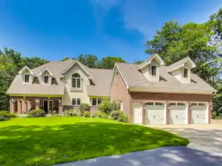 Stunning Two-Story Brick Residence Perched on a Scenic Hill