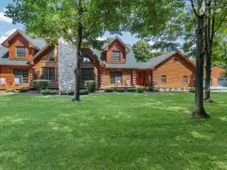 Beautifully Maintained Log-Sided Home on 8.23 Acres