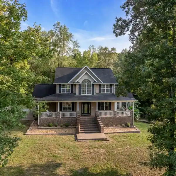 HOME NESTLED ON 37 ACRES OF PRIVATE COUNTRYSIDE