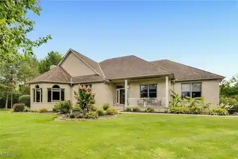 Beautifully Maintained Ranch Complete with a Private Pond