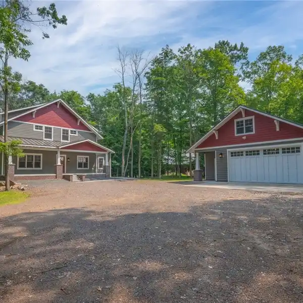 STUNNING CRAFTSMAN LAKE HOME ON SHELL LAKE – 150’ OF SANDY SHORELINE